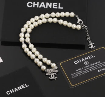 Chanel Romantic Pearl Bow Charm Necklace