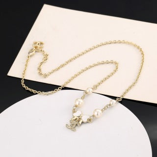 Chanel Pearl Bow Charm Necklace